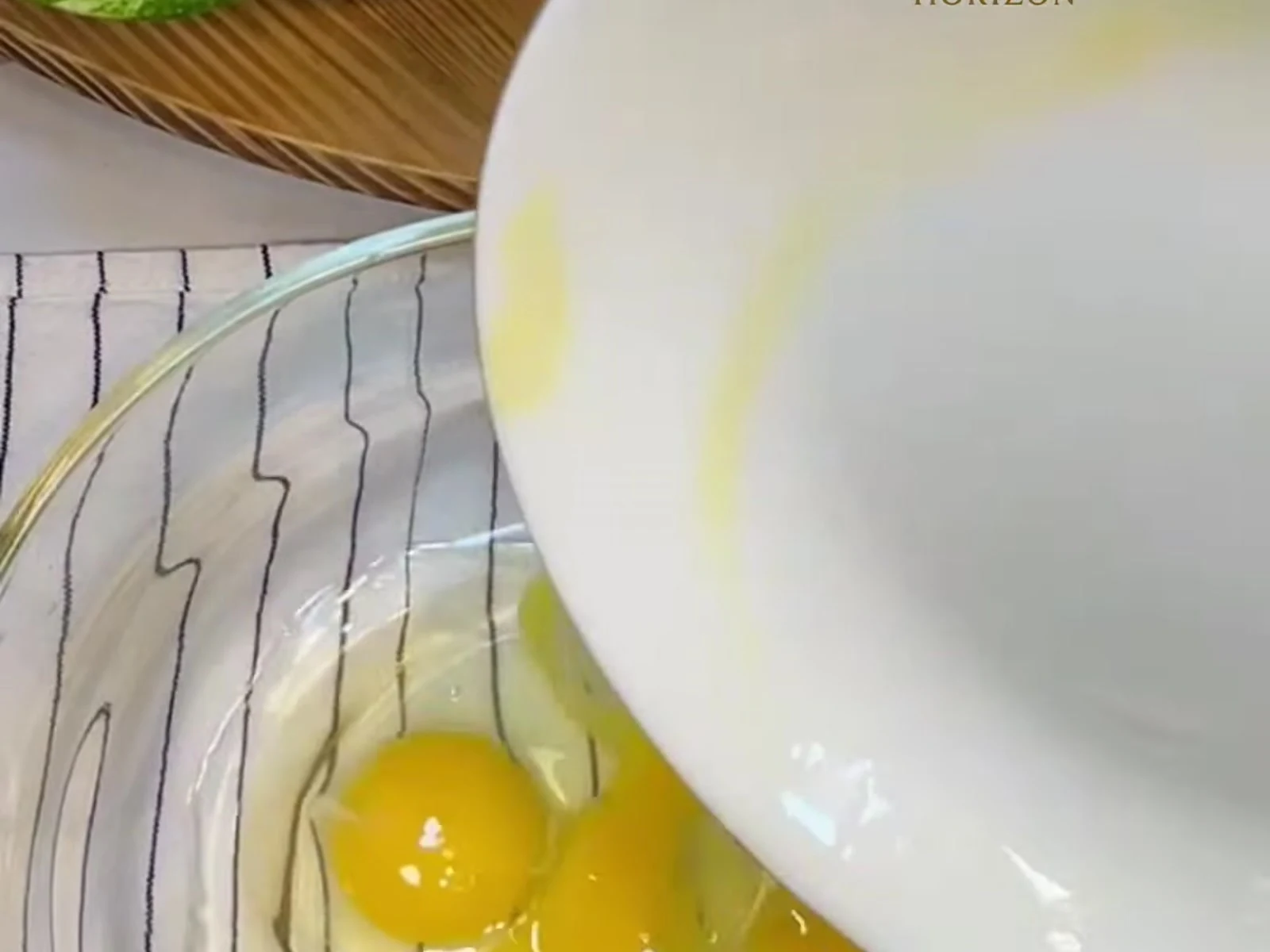 Crack the four eggs into a wide bowl and add the tablespoon