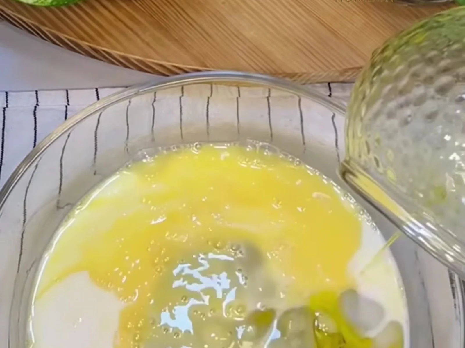Add the room-temperature milk and the olive oil and whisk