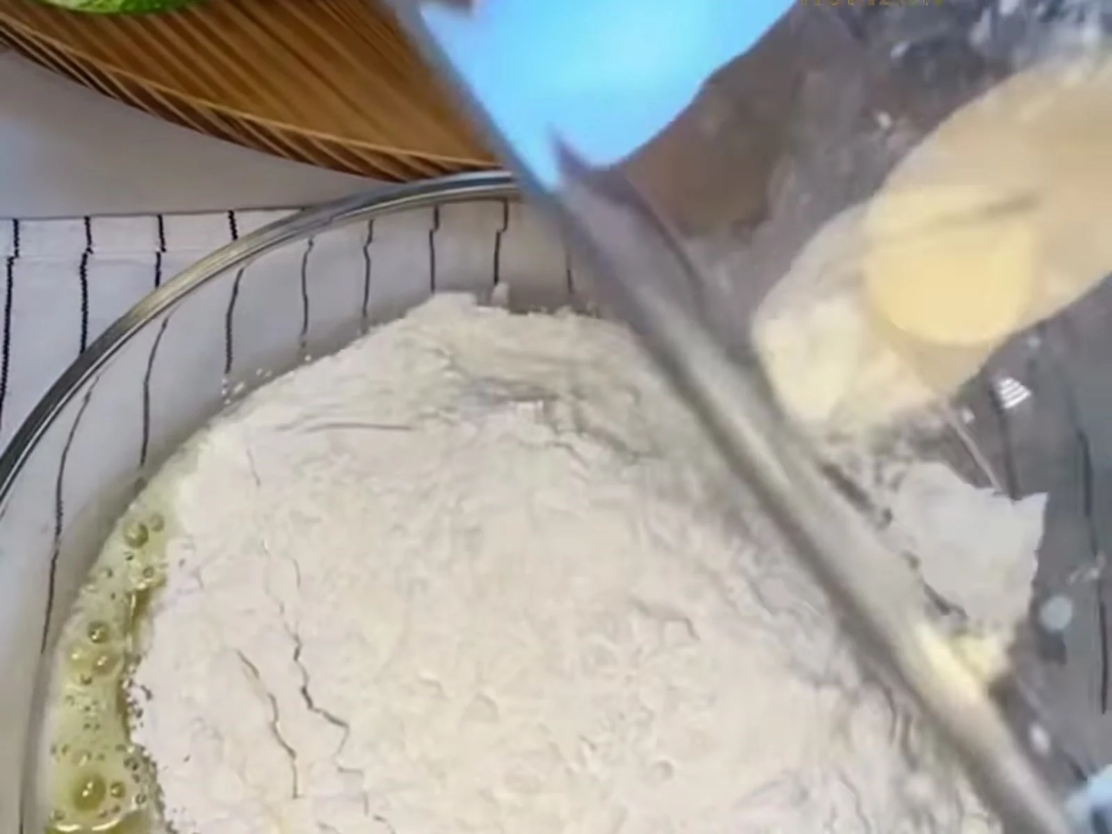 Add the sifted flour together with the baking powder and