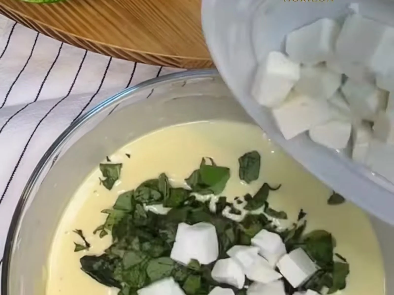 Add the chopped fresh green za'atar and the cubed Nabulsi