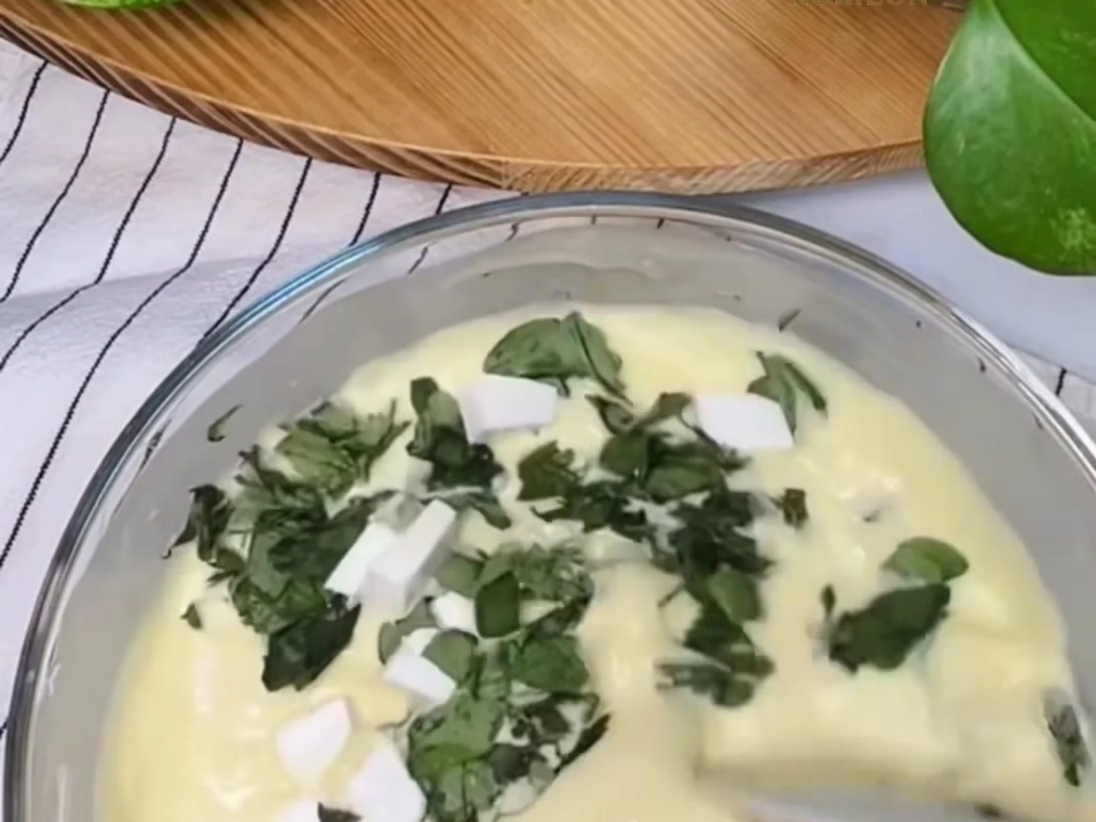 Fold gently with a spoon or spatula just until the herbs