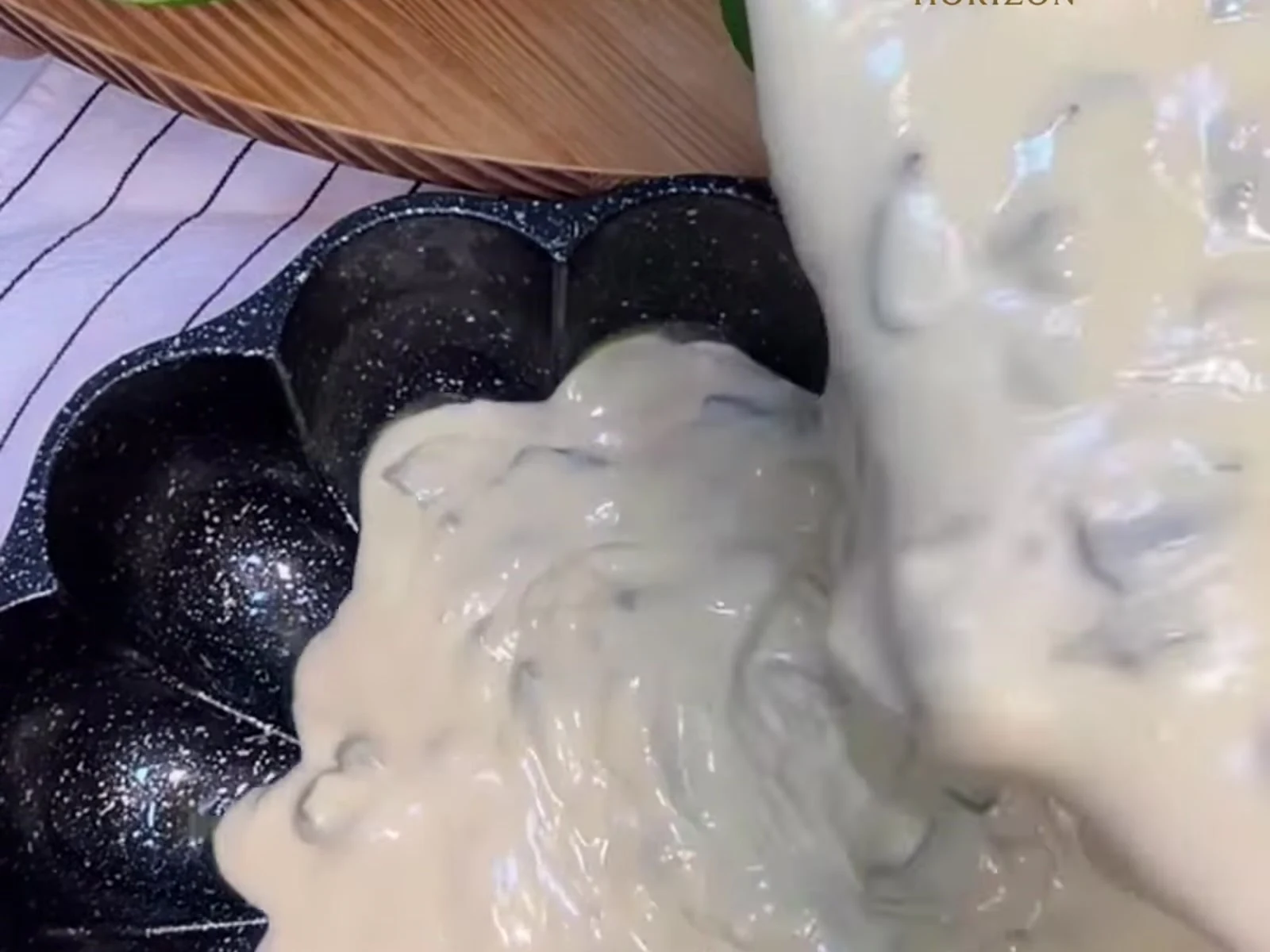 Oil a tin about 24 cm across, pour in the batter and level